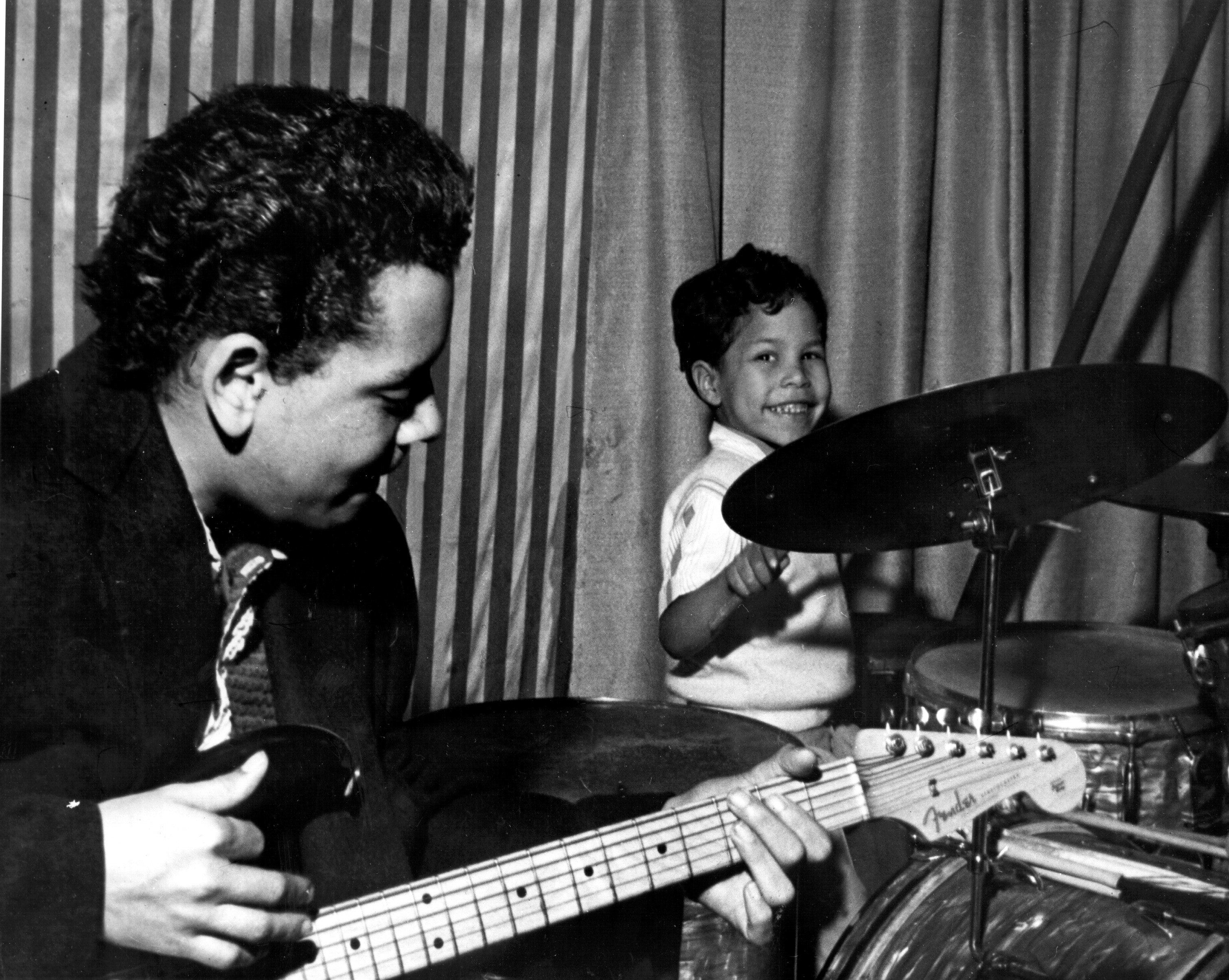 Johnny Otis onstage with his young son Shuggie Otis on the drums, 1957. Photo via Michael Ochs Archive/Getty Images.